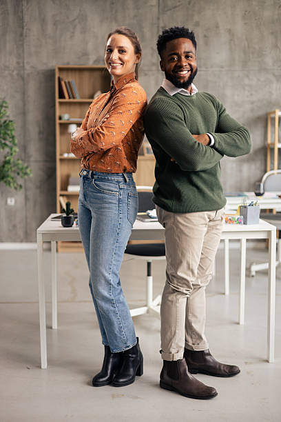 istock Diverse business people smiling standing back to back in office 2250942913