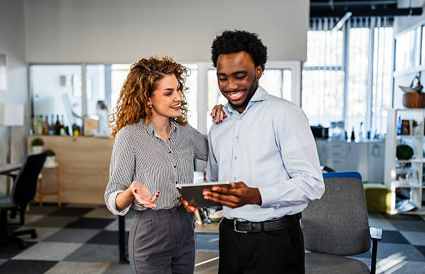 istock Business colleagues discussing data on digital tablet in office 2250946990