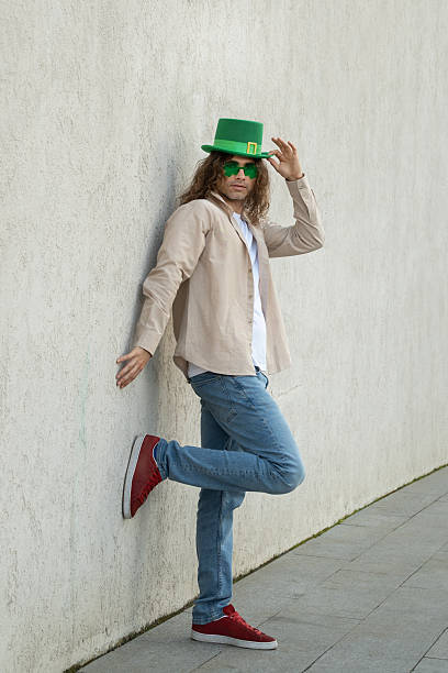 istock Man Wearing Shamrock Glasses and Green St. Patrick's Hat 2250950090