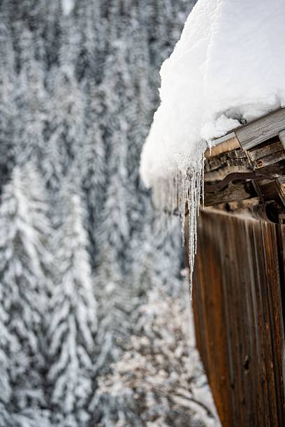 istock Icicles on Winter Wooden Cabin 2250953291