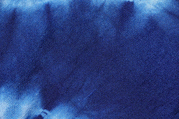 istock Blue Tie-dye Textile pattern, macro shot of indigo shibori fabric Texture 2250954112