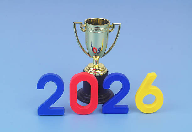 istock Gold trophy champion cup and numbers 2026 on blue background. 2250954210