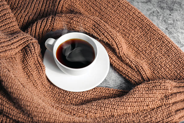 istock Winter coffee cup on Cozy knit shirt 2250954630