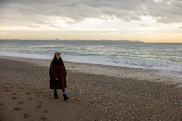 Aktau, Kazakhstan (Qazaqstan), 22.10.2023 - A lonely man on the shore admires the Caspian Sea. Caspian Sea in Aktau city
