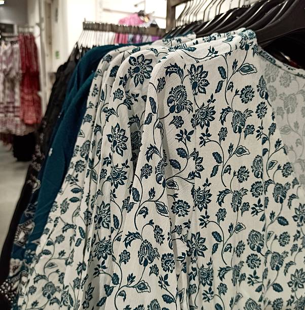 istock White floral kurti displayed on hanger at a boutique 2250955591