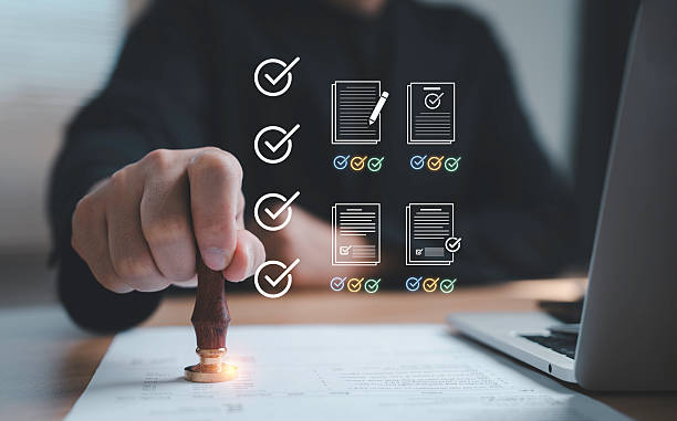 istock Businessman hand sealing paperwork with digital checklist icons representing verification quality audit accuracy and official confirmation in modern business processes as an approval audit concept 2250959931