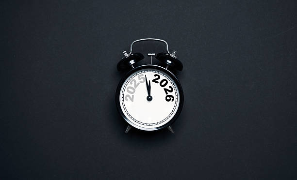 istock A clock showing the transition from 2025 to 2026 on a dark background representing a new year countdown concept symbolizing time change preparation motivation and fresh goals for the upcoming year. 2250960098