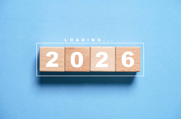 istock Wooden blocks displaying 2026 with loading text on a clean background representing a happy new year countdown concept symbolizing new beginnings future goals motivation and positive planning. 2250962377