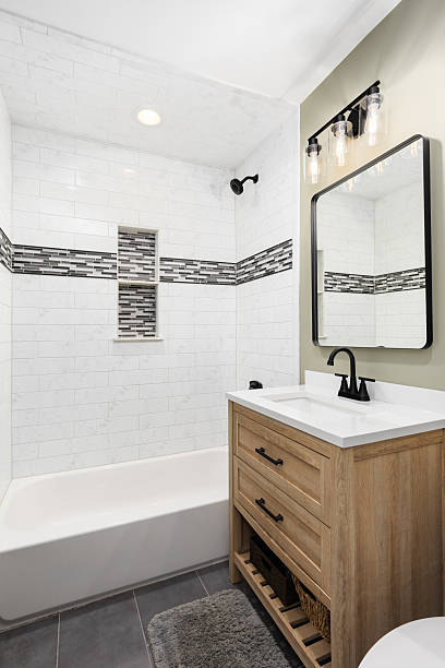 istock Modern Bathroom Vanity with White Subway Tile Shower and Black Fixtures. 2250962433