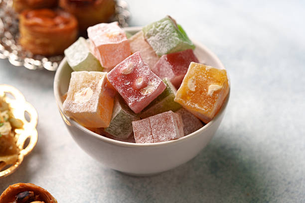 istock Colorful Turkish delight served in a bowl with assorted sweets on a light blue background 2250963307