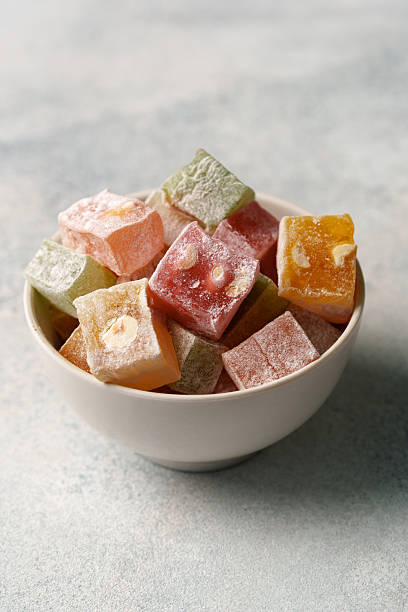 istock Colorful Turkish delight assortment in a white bowl on a gray background 2250963310