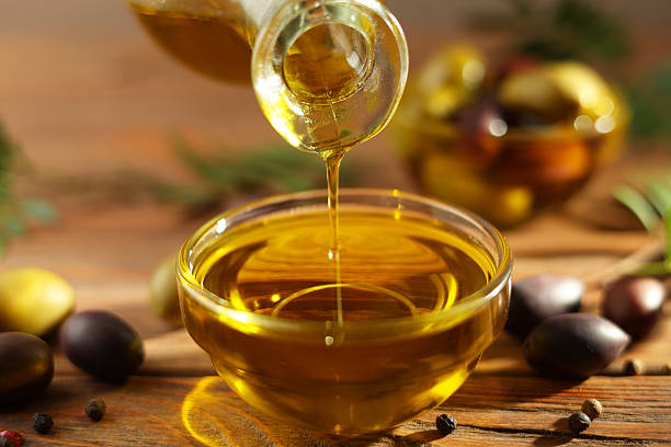 istock A premium olive oil with olives and fresh leaves, 2250964304