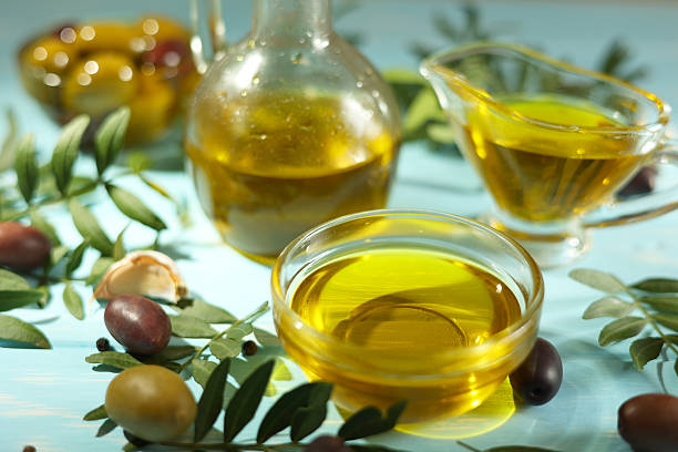 istock A premium olive oil with olives and fresh leaves, 2250964358