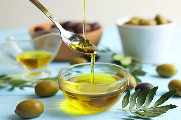istock A premium olive oil with olives and fresh leaves, 2250964468