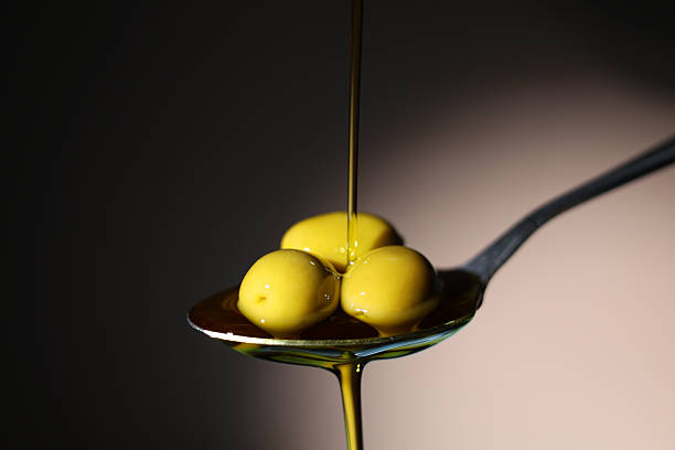 istock A premium olive oil with olives and fresh leaves, 2250964491