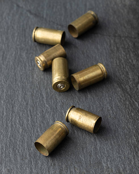 istock Used old ammunition casings over stone background 2250969283