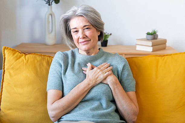 istock Content senior woman showing gratitude with hands on chest 2250970467