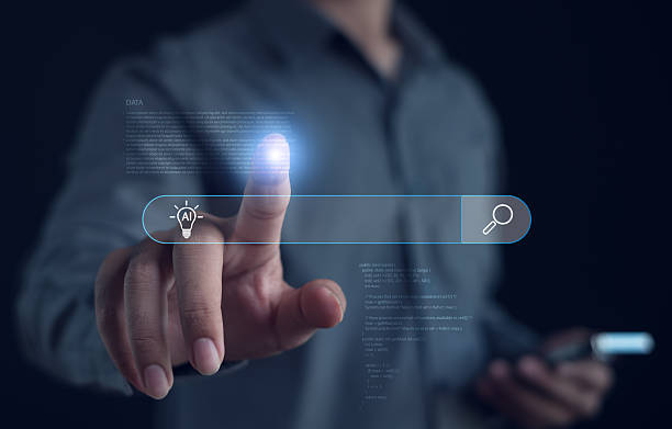 istock Businessman interacting with a virtual AI search bar, highlighting digital innovation, smart technology, and intelligent data solutions in a modern user interface concept. 2250971022