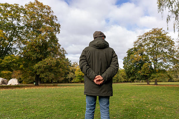 istock Mature Man Enjoying a Peaceful Walk in the Park 2250971123