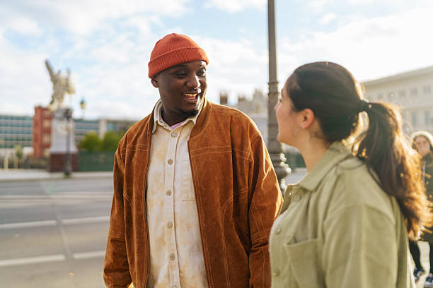 istock Happy Couple Walking and Talking on a Sunny City Street 2250972700