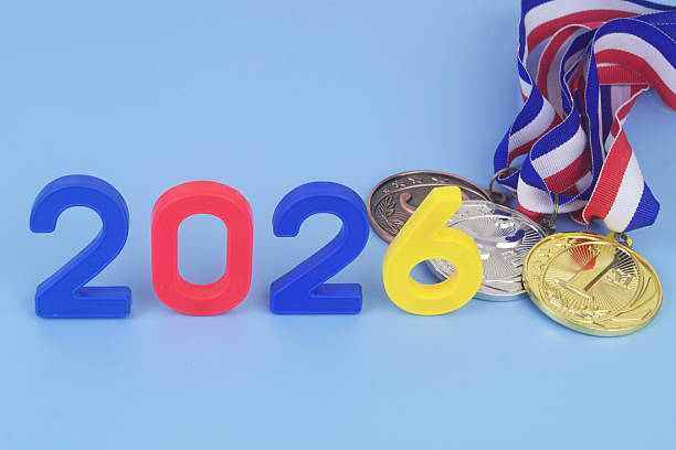 istock Gold, silver and bronze medal with numbers 2026 on blue background. 2250972780
