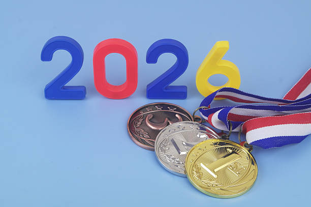 istock Gold, silver and bronze medal with numbers 2026 on blue background. 2250973095