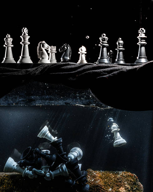 An illustration of war in a chess game with a chess game on water by sinking dead chess pieces.