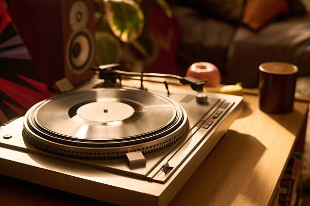 istock Vintage Turntable Playing Vinyl Record in Cozy Living Room Setting 2250977798