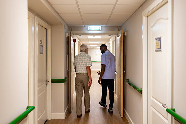 istock Healthcare Worker Supporting a Resident 2250981527