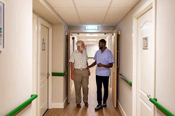 istock Caring Health Worker Walking with a Resident 2250981535