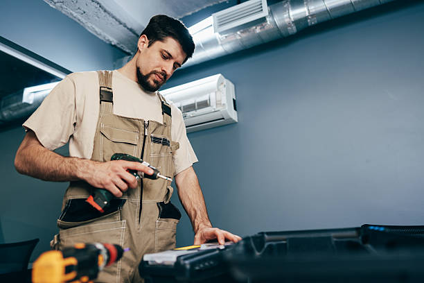 istock Skilled worker examines tools while preparing for a repair job in a modern workspace 2250982037