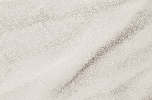 istock cloud dancer fabric texture in a neutral, off-white color with soft folds 2250983032