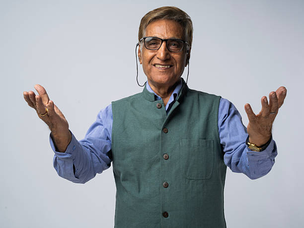Portrait of Young asian businessman on isolated white background. Handsome middle aged Indian businessman in office uniform.