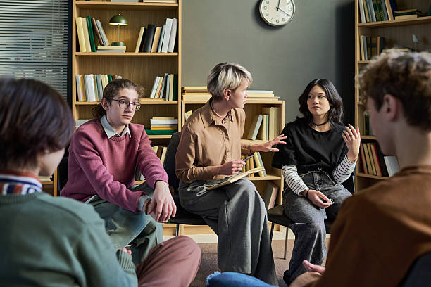 istock Diverse Group of Young People Engaging in Group Therapy Session Discussion 2250983733