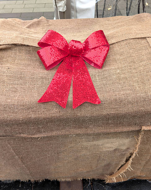 istock Red Gift Bow on Burlap at a Canadian Christmas Event 2250984905