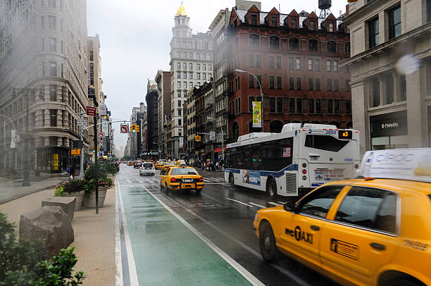 Blurred traffic and people in New York City.