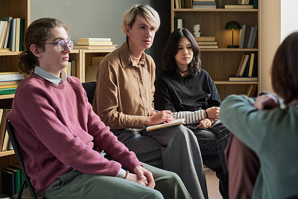 istock Diverse Young People Participating in Group Therapy Session and Listening Attentively 2250985845