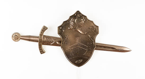 Golden sword and shield isolated on white background