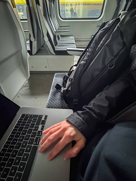 istock Person working on a laptop while traveling 2250987202