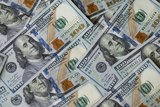 istock overhead view of one hundred dollar bills 2250988029