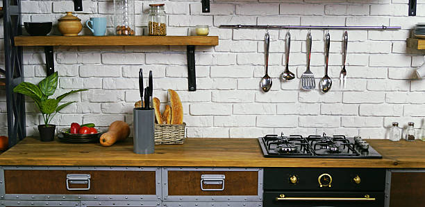 istock Modern wooden kitchen interior mockup featuring countertop, stove, kitchen tools, vegetables, and bread basket 2250988635