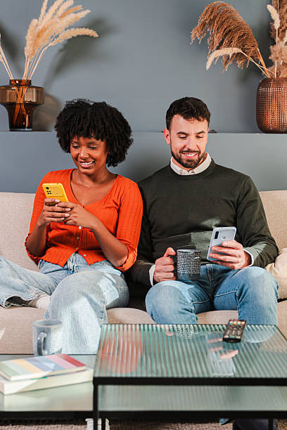 istock Couple enjoying their time together while using smartphones and engaging with mobile applications 2250988877