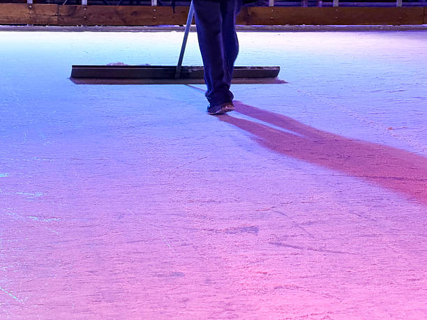 Light blue ice rink with reflections, abstract skating background texture
