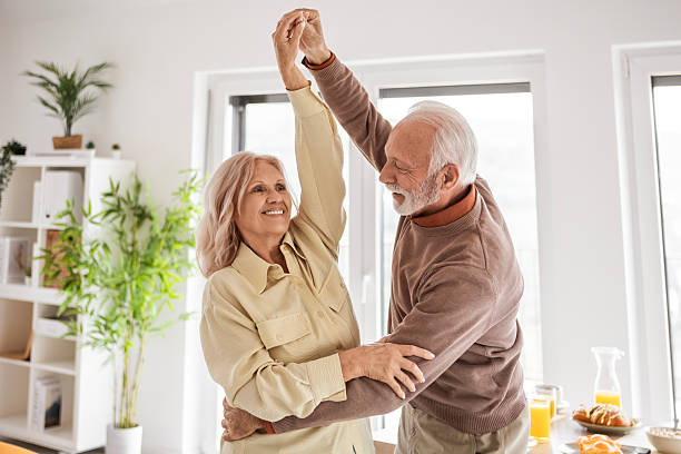 istock Happy Elderly Partners Sharing a Dance at Home 2250991342