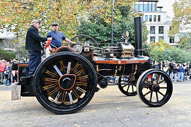 A vintage steam traction engine proceeds down a street lined with spectators during the annual Lady Mayor's Show, a historic and traditional civic parade in London, United Kingdom, 8 November 2025
