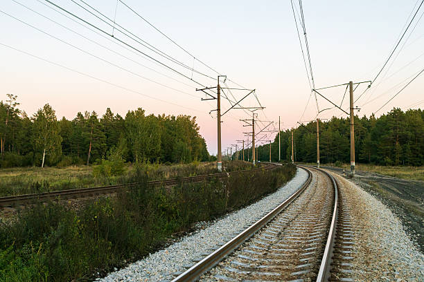 istock a turn on the railway tracks passing through a wooded area 2250993171