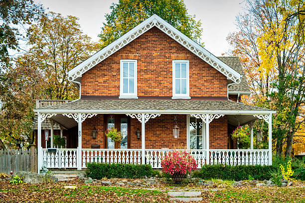 A Victorian style brick house in Bradford, Ontario, Canada, on a cloudy day.