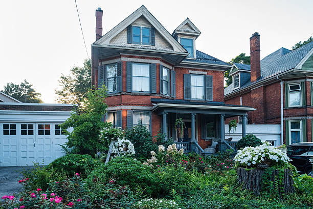 A brick house in a residential district in Hamilton, Ontario, Canada, on a sunny day.