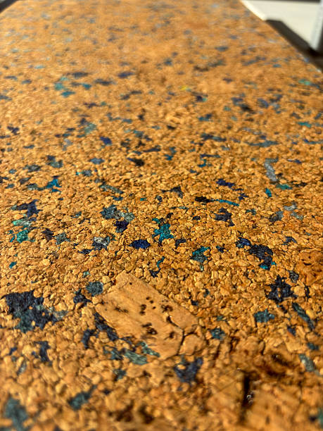 Cork surface with blue speckles in warm sunlight