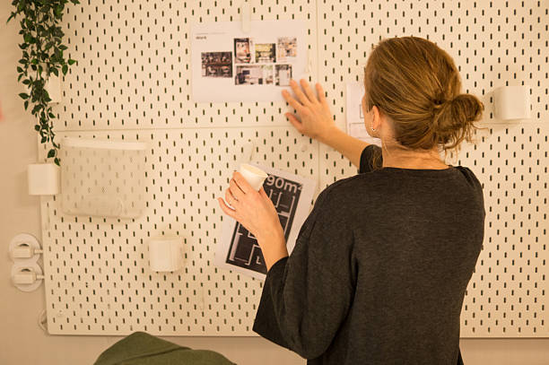 istock Businesswoman Organizing Moodboard and Architectural Plans 2251002820